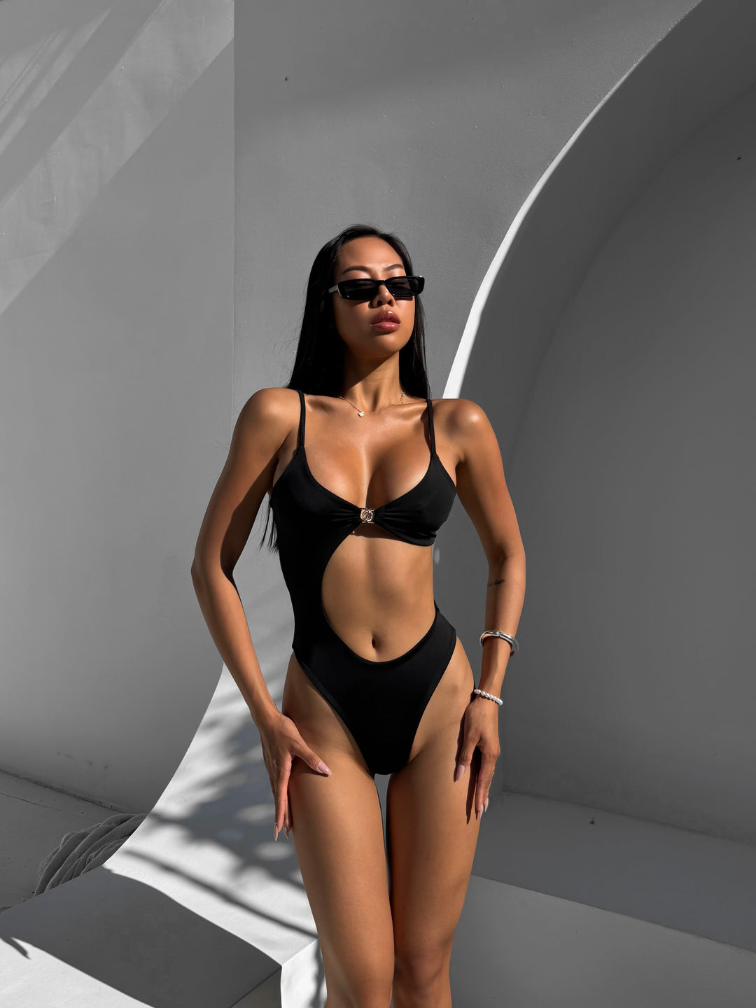 Coral Asymmetric Cut Out Waist One Piece in Black